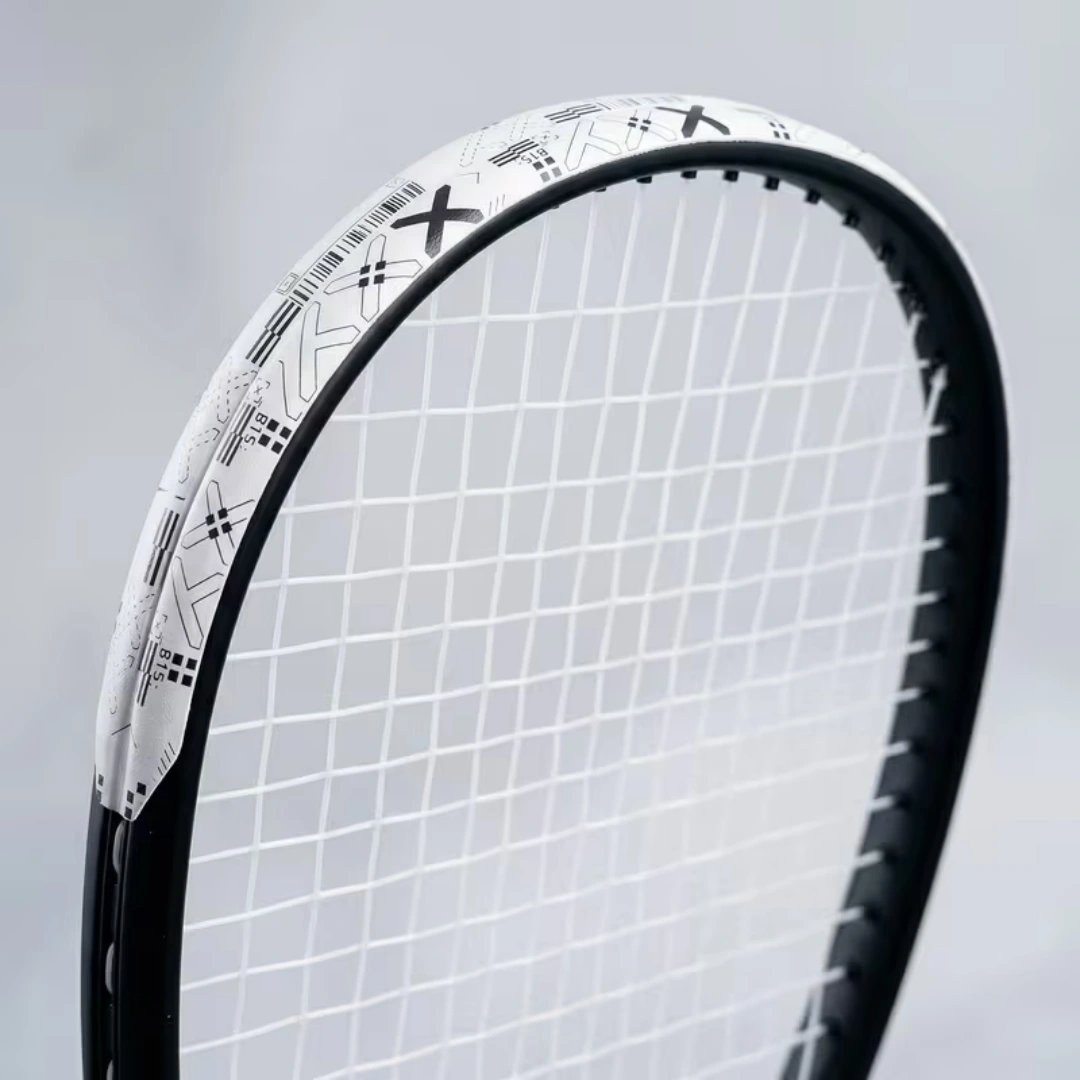 Tennis racket head with anti-abrasion edge guard tape